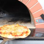 fresh baked pizza in Wood Fire Pizza Oven